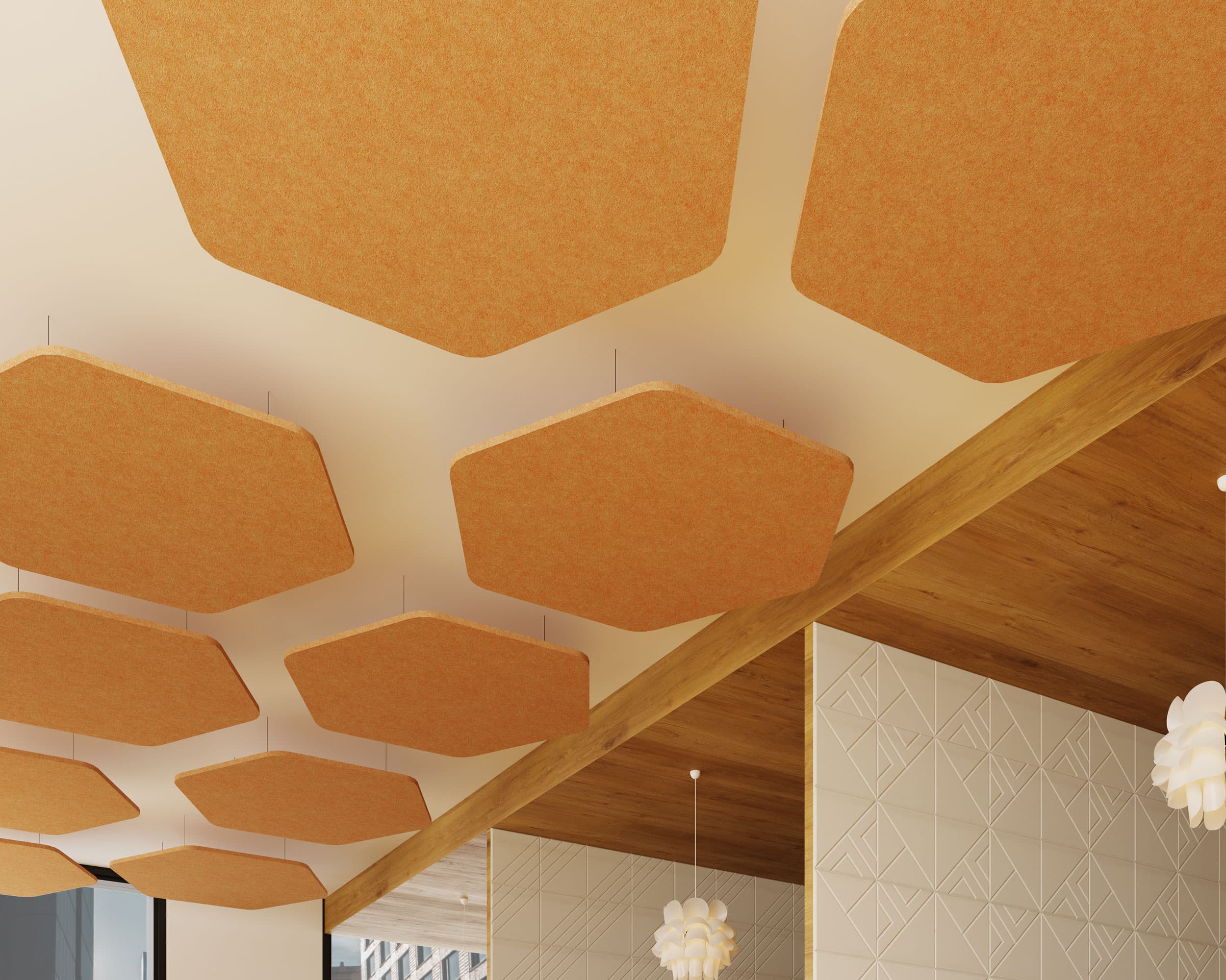 A ceiling with orange, hexagonal acoustic felt ceiling clouds arranged in a pattern, suspended from the white ceiling. The walls are adorned with geometric, textured patterns, and part of a wooden beam and white, geometric hanging lamps are also visible.
