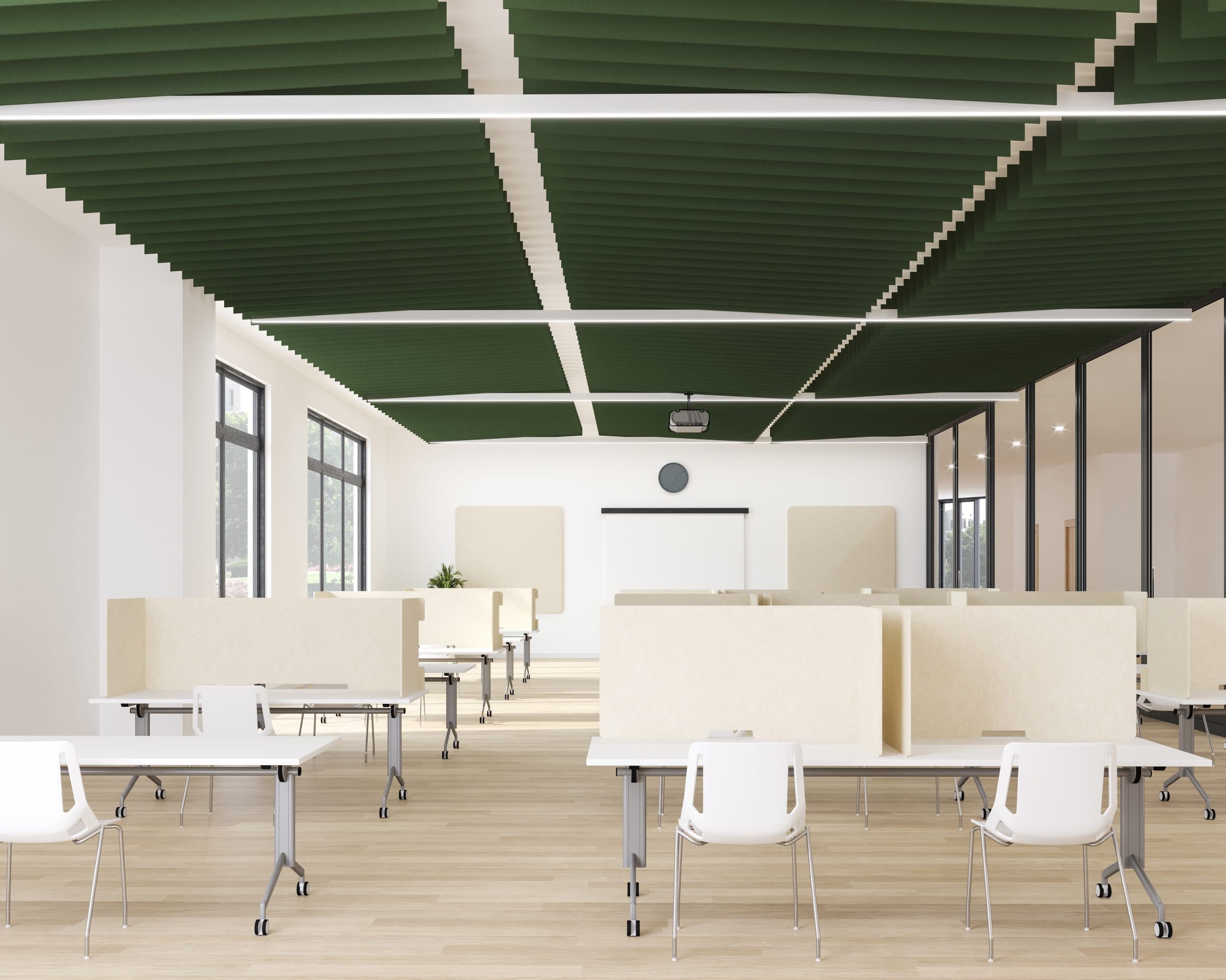 A spacious classroom with large windows, white walls, and green winged acoustic baffles, which enhance sound quality, suspended from the ceiling. There are rows of rectangular tables with white chairs, separated by beige dividers. At the front, there's a whiteboard and a clock above it. Natural light fills the room.