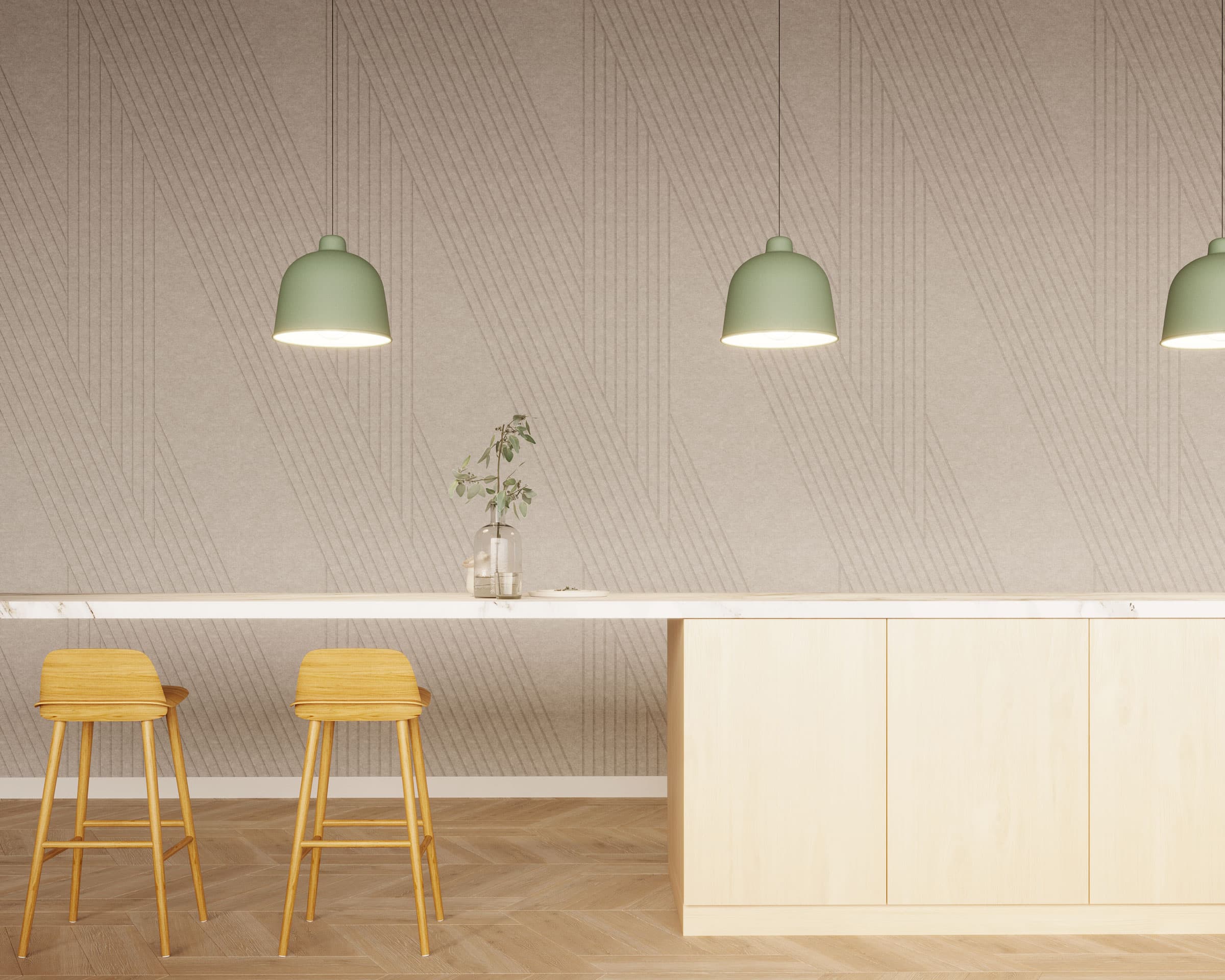 A minimalist kitchen features light wood cabinetry, a white countertop, and two wooden bar stools. Three sage green pendant lights hang from the ceiling. A single vase with some foliage decorates the counter. The acoustic felt panel wall has a subtle geometric pattern for added texture.