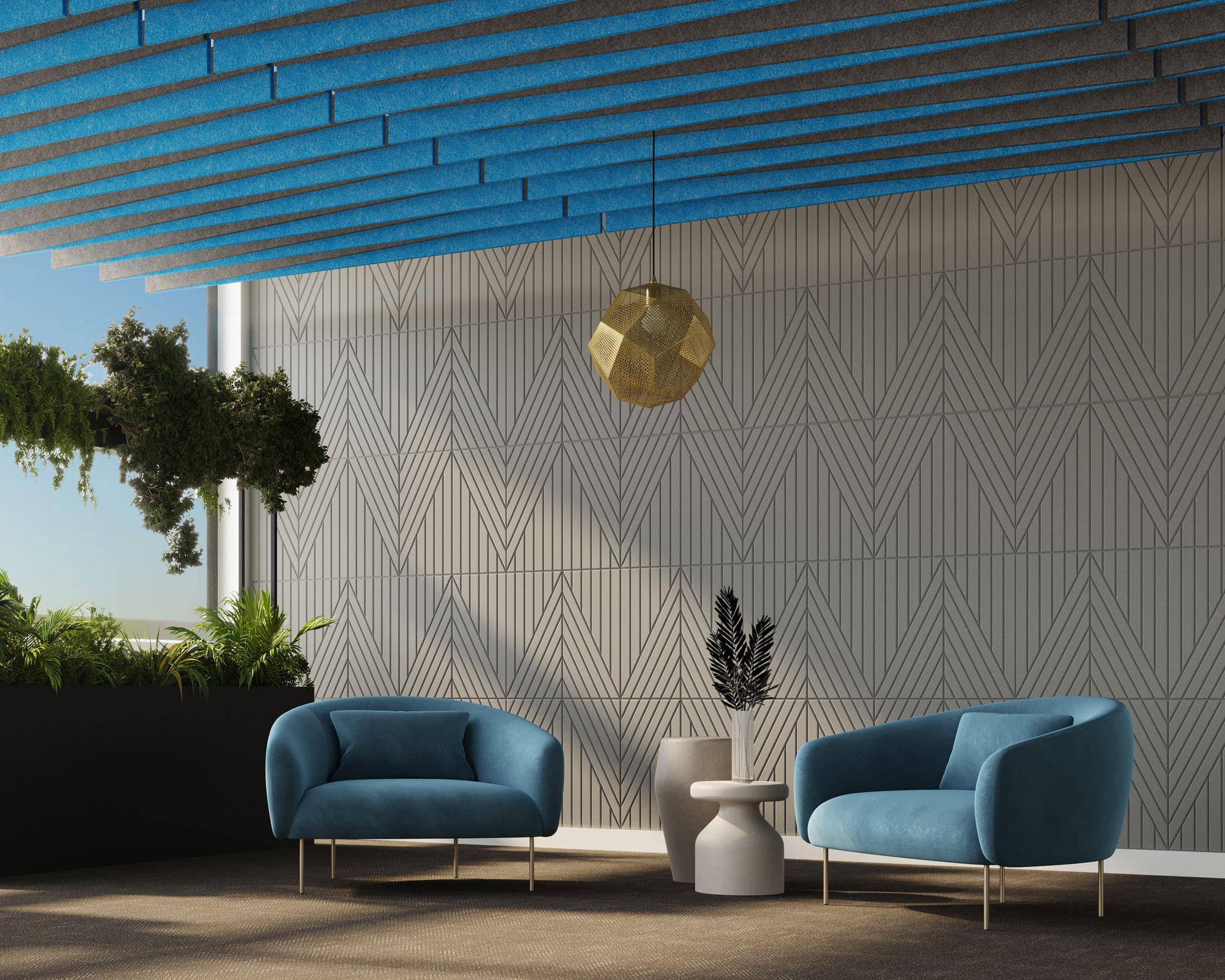 A modern lounge area featuring two blue armchairs, a small white side table with a black decorative item, and an acoustic felt wall tile with a geometric pattern. A gold pendant light hangs from the ceiling, which has blue panels. Green plants are in the left corner near a window.
