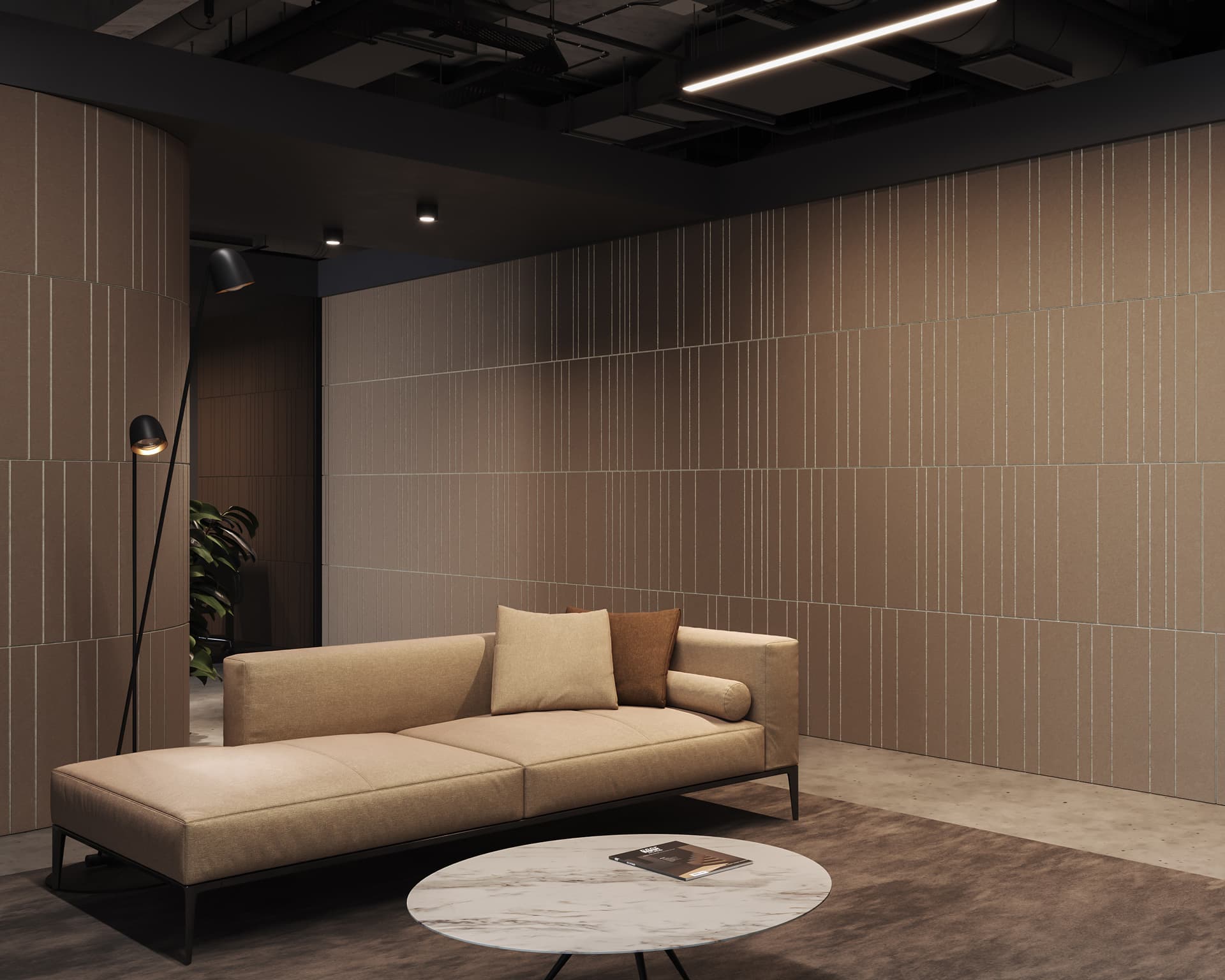 A modern living room with beige walls and an L-shaped beige sofa adorned with matching cushions features a sleek black standing lamp illuminating the space. An acoustic felt wall panel adds texture, while a small circular marble coffee table with a magazine rests in front of the sofa. Ceiling lights provide additional light.