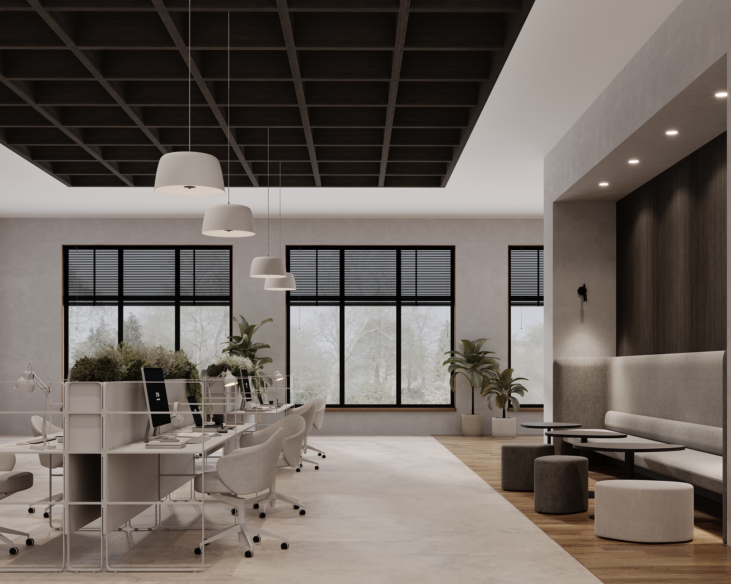 A modern office space with large windows, featuring desks with computers and white office chairs. The ceiling has a dark grid design with hanging white lights and acoustic felt for sound insulation. There are plants near the windows and a cozy sitting area with a bench, small tables, and stools.