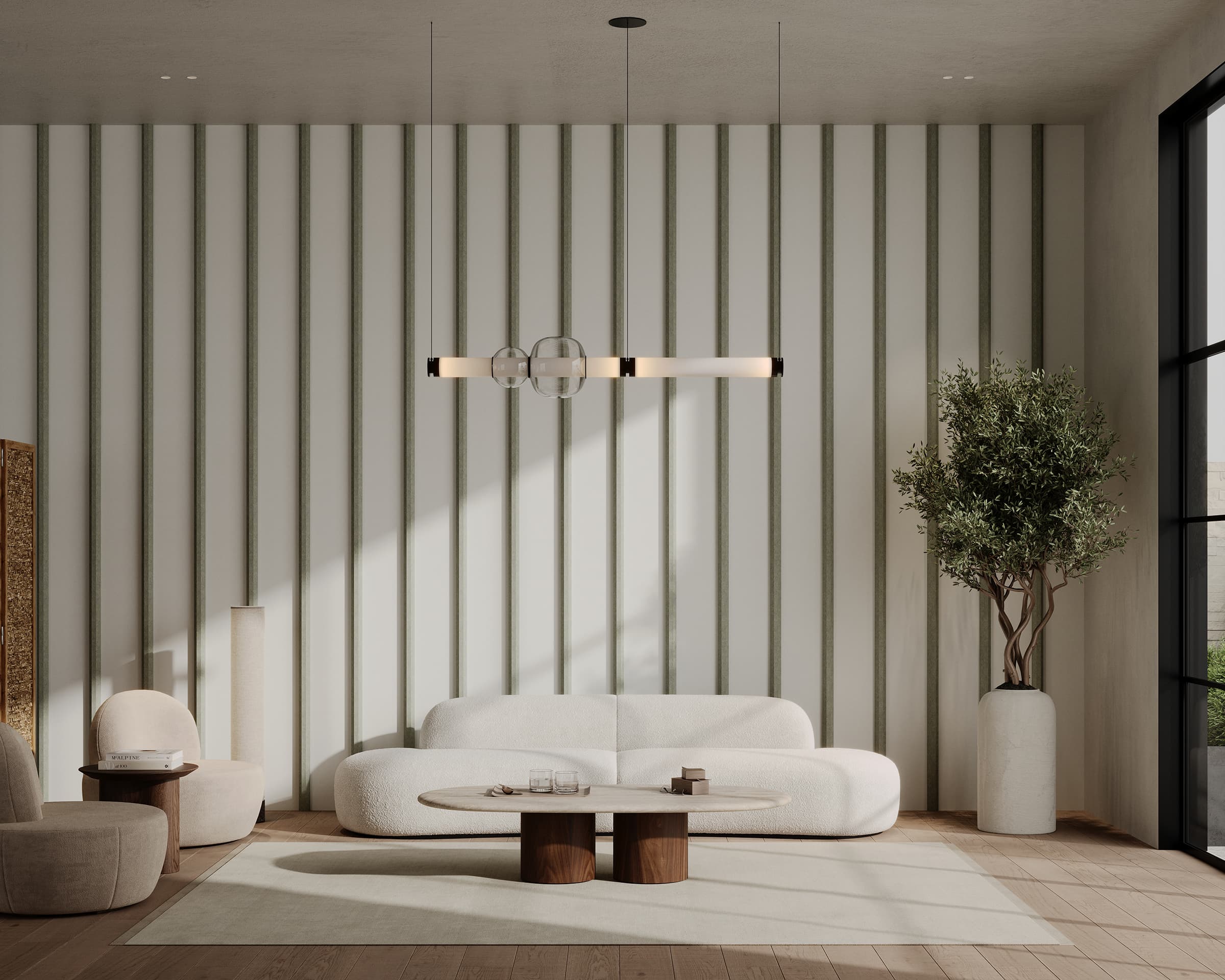 A modern living room with minimalist decor features a white, curved sofa and round coffee table on a light wooden floor. A large potted plant stands beside the window, and a contemporary light fixture hangs from the ceiling. Vertical acoustic felt panels decorate the wall.