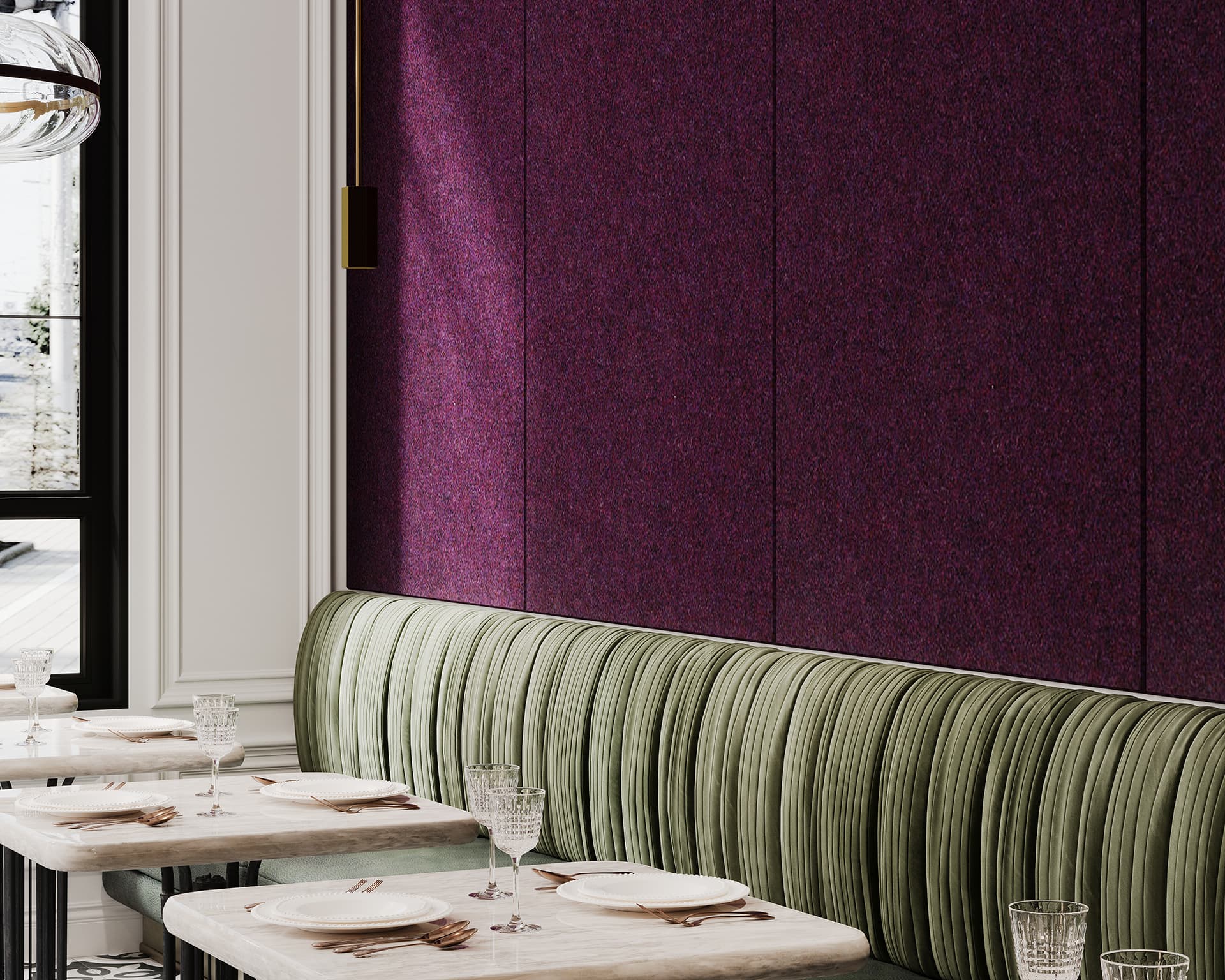 A chic dining area with green upholstered bench seating along a wall covered in deep purple acoustic felt panels. The space features elegant, mirrored tables set with fine china and glassware, and large windows allowing natural light to filter in.
