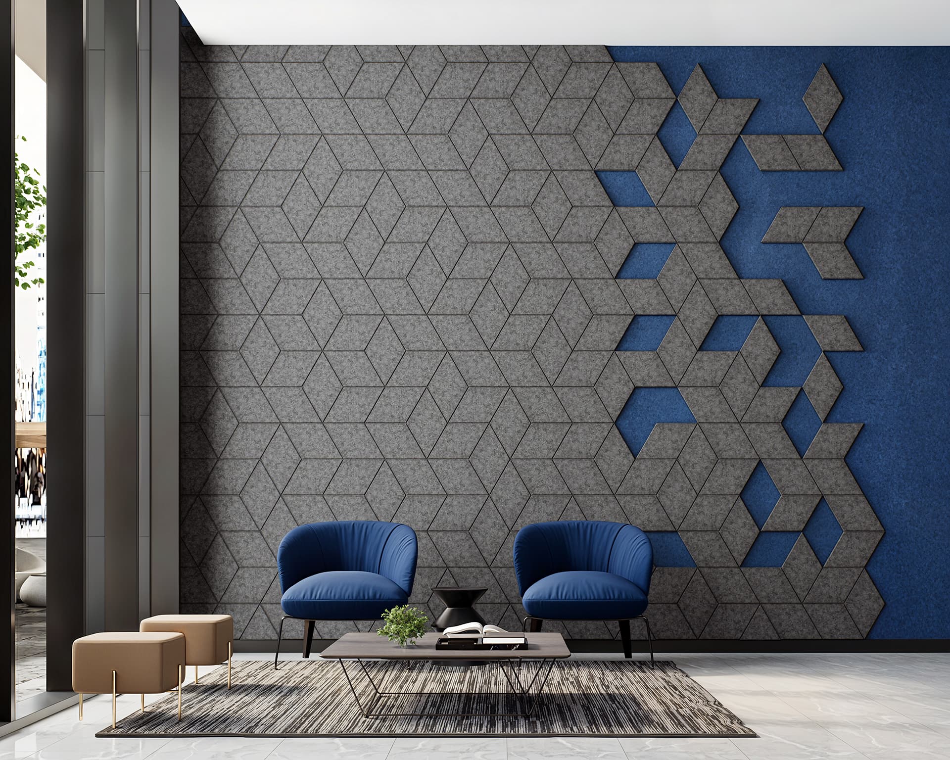 A modern lounge featuring two blue armchairs and a black coffee table on a textured area rug. The wall behind has a geometric acoustic felt design in gray and blue, with parts cut into 3D shapes. Two wooden stools sit to the left, and a glimpse of greenery is visible through a tall window.