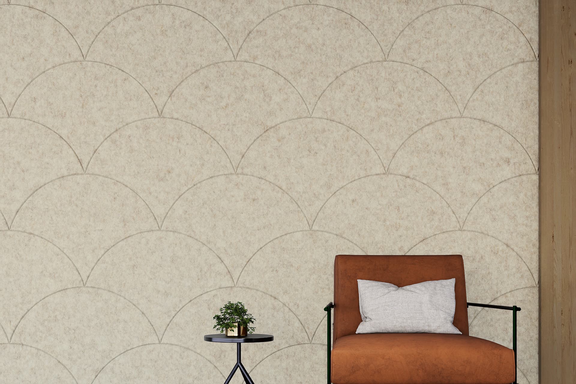 A minimalist interior features a light beige acoustic felt with an overlapping arch pattern. A cushioned brown chair, with a white pillow, is placed beside a small black side table holding a small potted plant, set against the patterned wall.