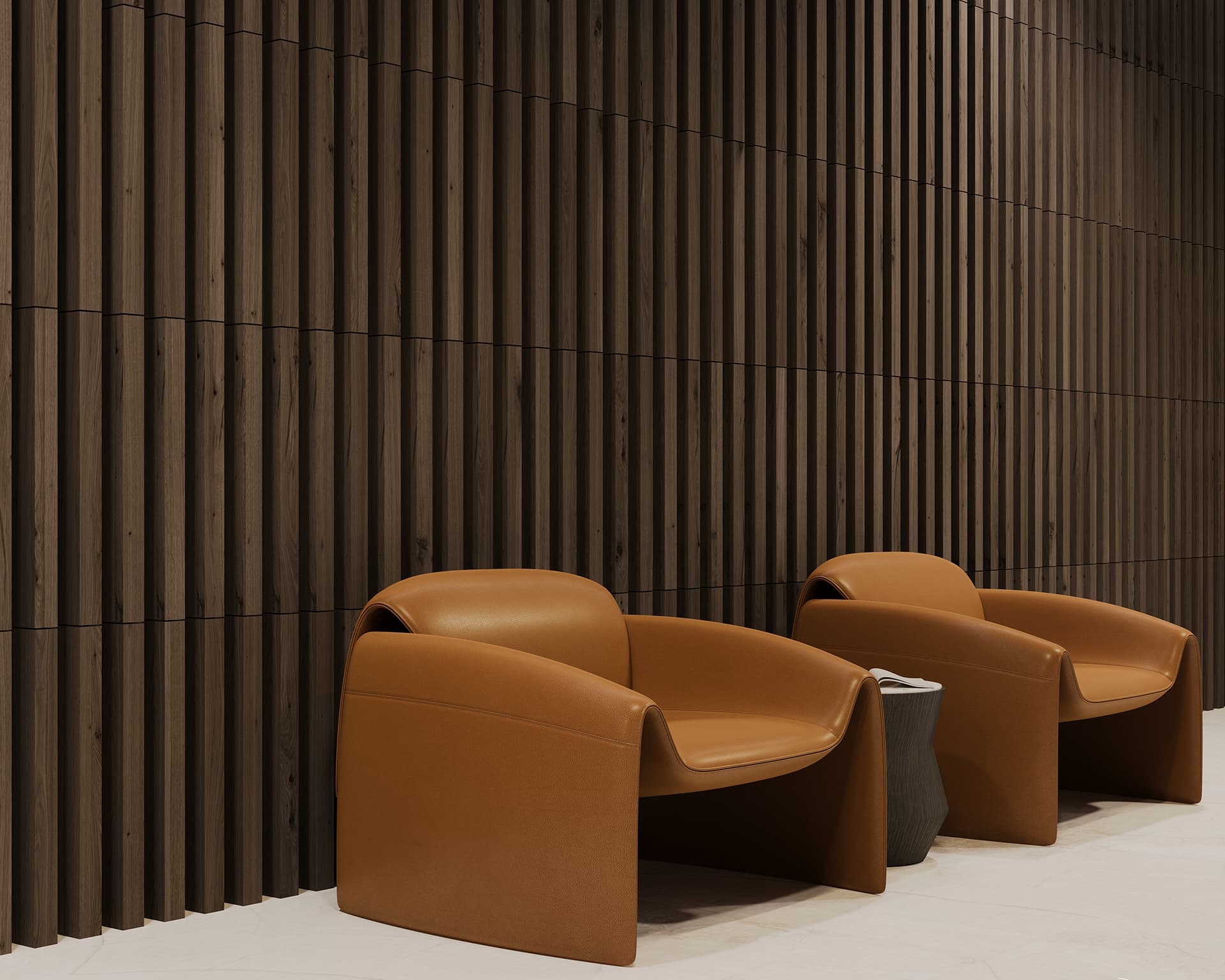 Two modern brown armchairs sit against a dark ribbed woodgrain acoustic felt wall. A small, round table is positioned between the chairs. The light-colored floor creates a striking contrast with the rich textures of the wall and seating arrangement.