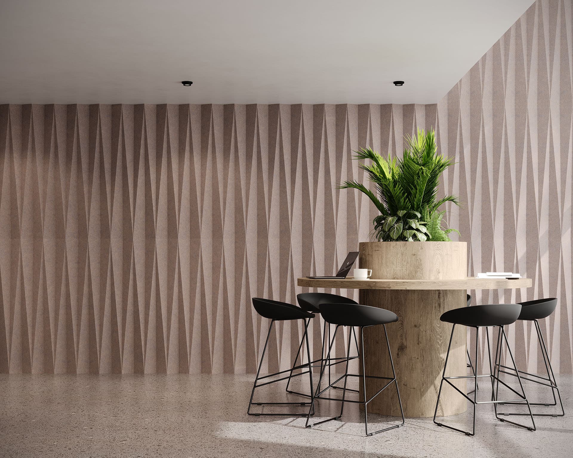 Modern interior with a round wooden table and a large potted plant. Four black barstool-style chairs surround the table, while dart-like acoustic felt wall tiles add texture to the beige walls' geometric pattern. The floor is polished concrete, enhancing the sleek ambiance.
