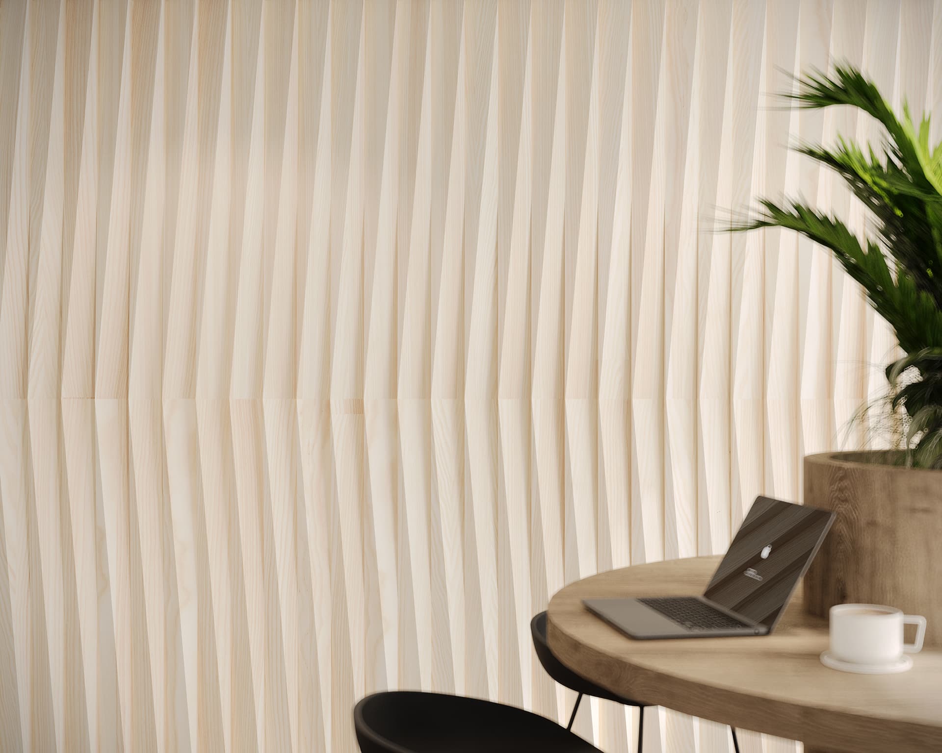 A sleek workspace with a curved, woodgrain table featuring a laptop and mug. A tall plant in a large pot is partially visible. The background showcases cream-colored acoustic felt wall tiles, creating a peaceful and modern atmosphere.