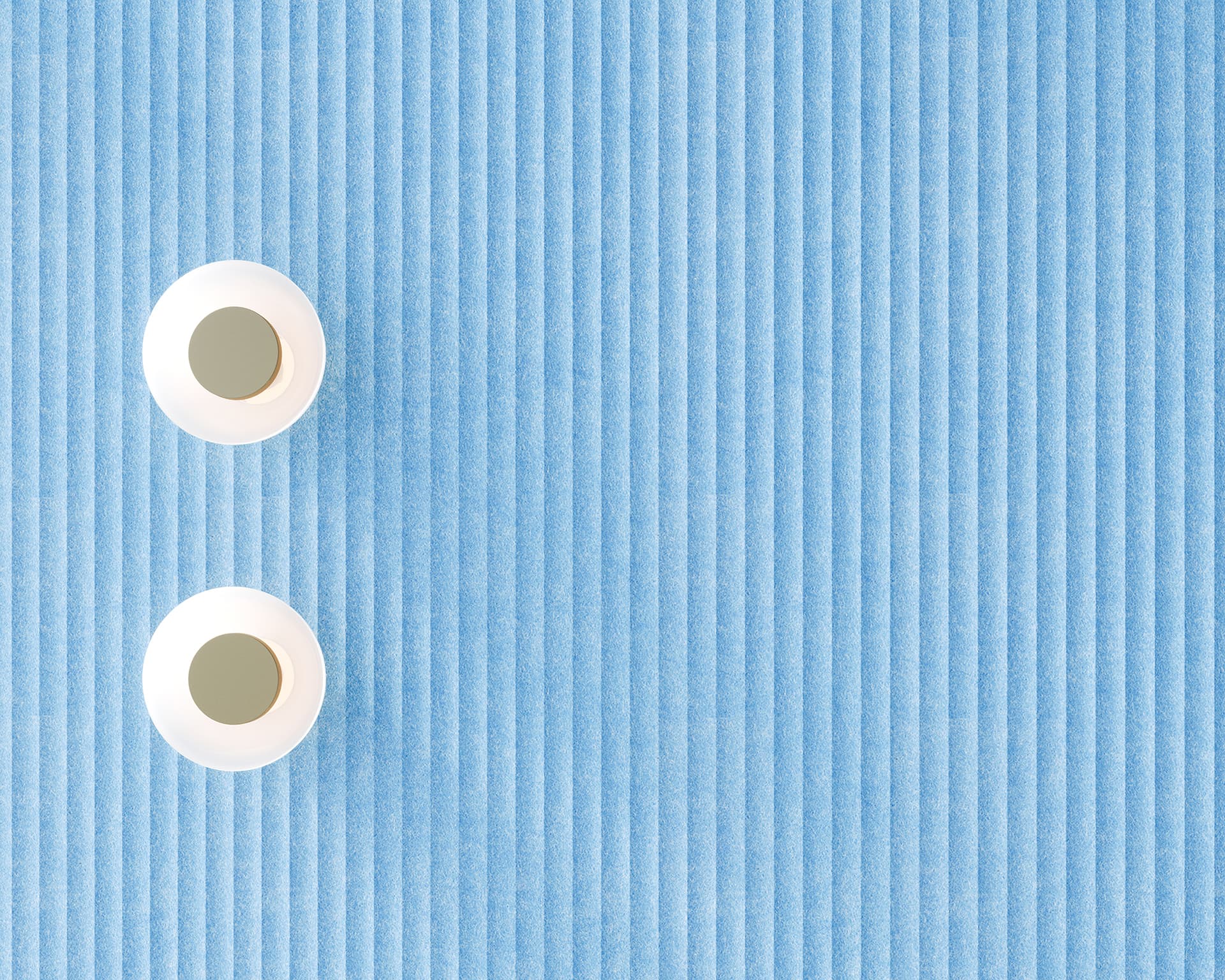 Two white lights sit on a light blue, vertically striped textured acoustic felt wall. The lights are positioned in the top left corner, one above the other, creating a minimalist arrangement with ample negative space on the right.