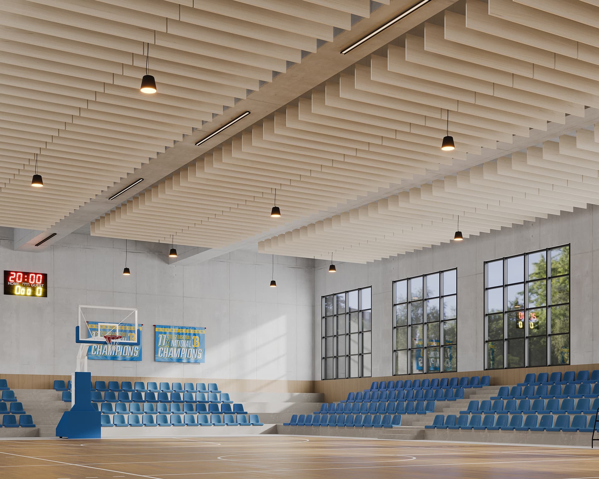 Empty indoor basketball gymnasium with blue seating. The court is polished wood with championship banners on the wall. Large windows let in natural light. Overhead lights set into an acoustic felt baffled ceiling illuminate the area, and a digital scoreboard shows 20:00 and 0.