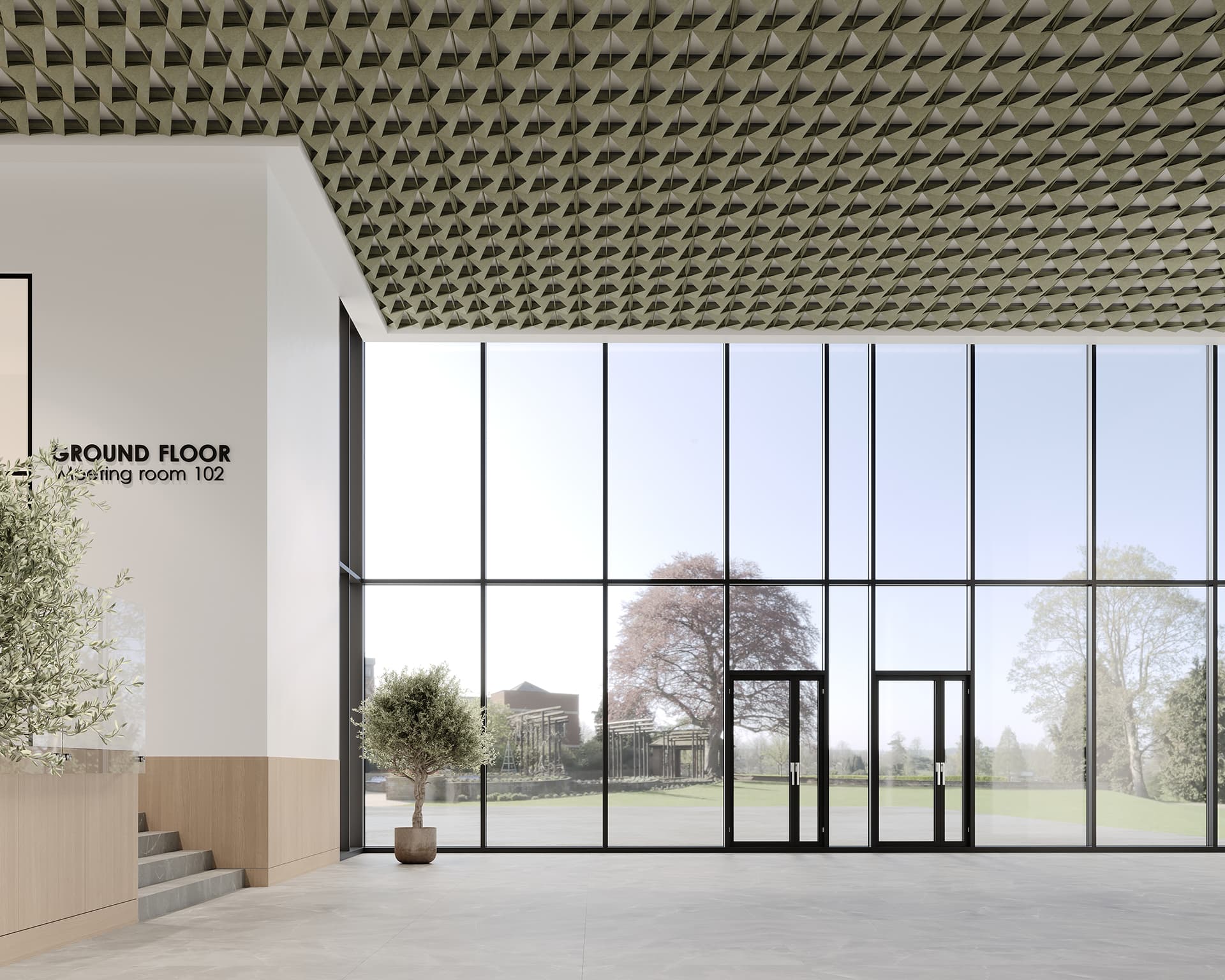 Spacious modern lobby with large floor-to-ceiling windows, two glass doors, and a patterned acoustic felt ceiling. Light streams in from outside, revealing a view of trees and a building. The text on the wall indicates a ground floor meeting room.