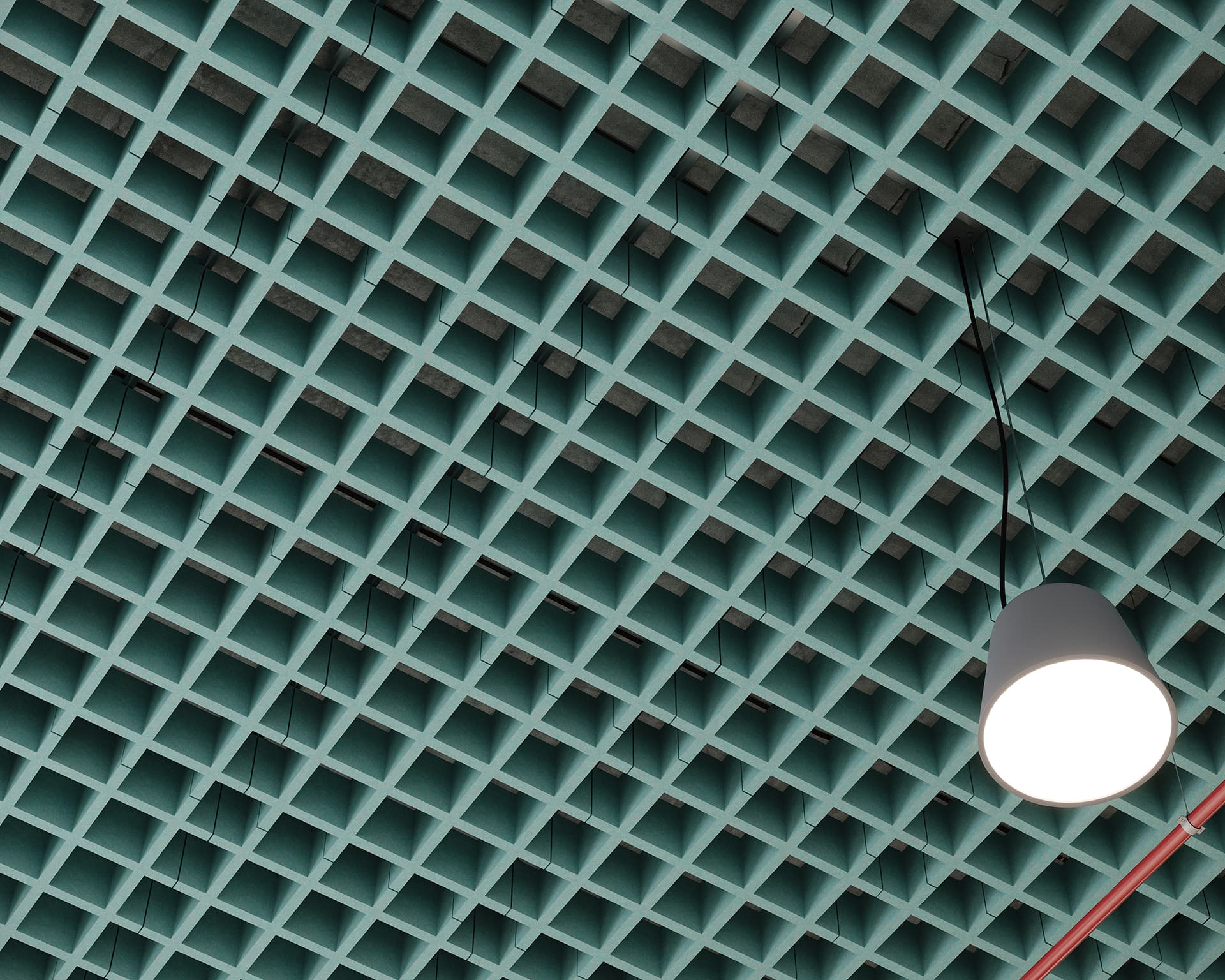 A grid-patterned teal acoustic felt ceiling with a modern hanging light fixture. The geometric design creates a repetitive square pattern, giving the space an industrial and contemporary look. A single white light shade hangs from the ceiling.