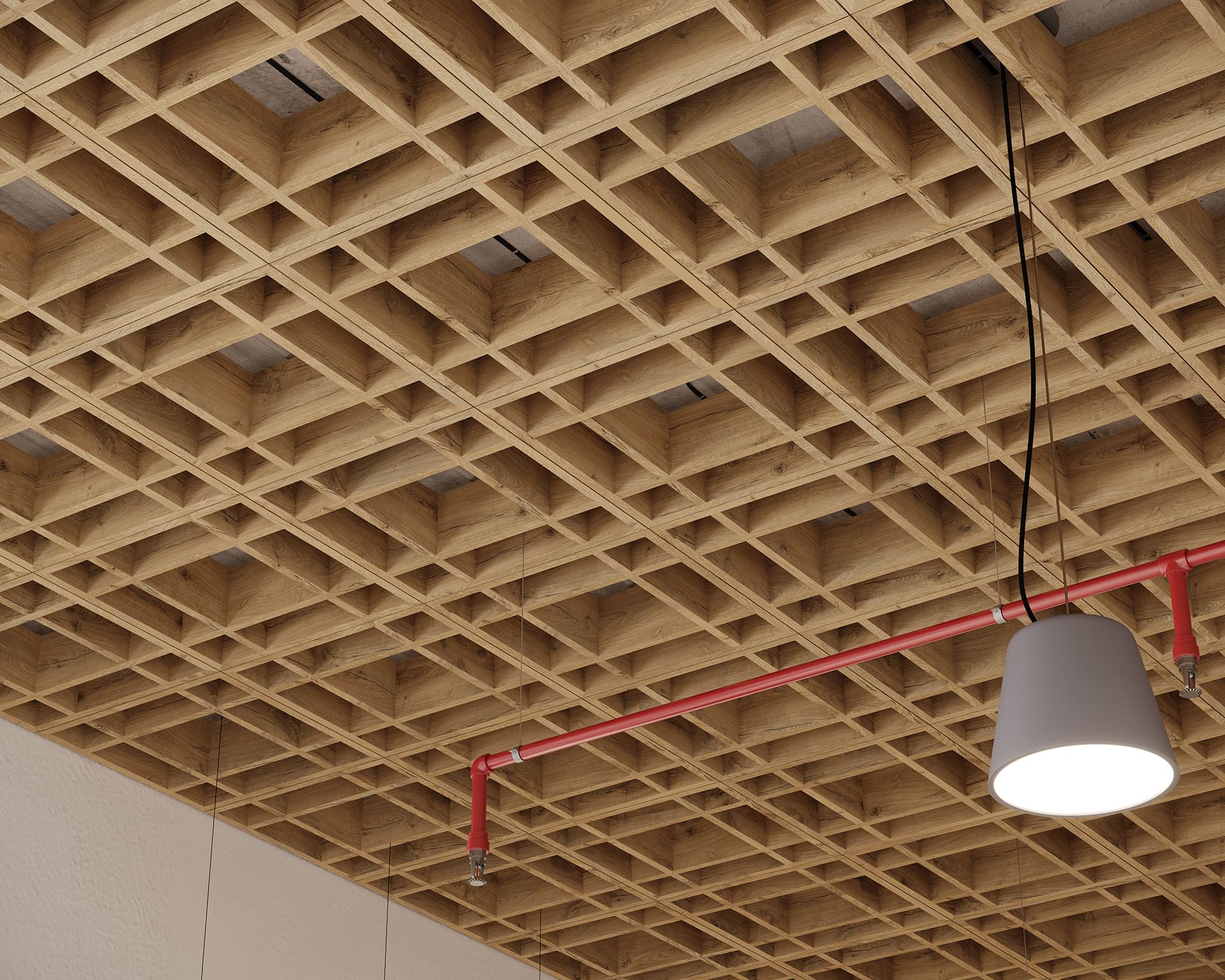 Woodgrain acoustic felt grid ceiling with square openings, featuring a red sprinkler pipe system. A white pendant light hangs from a black cord, illuminating the space. The design creates a modern and structured architectural look.