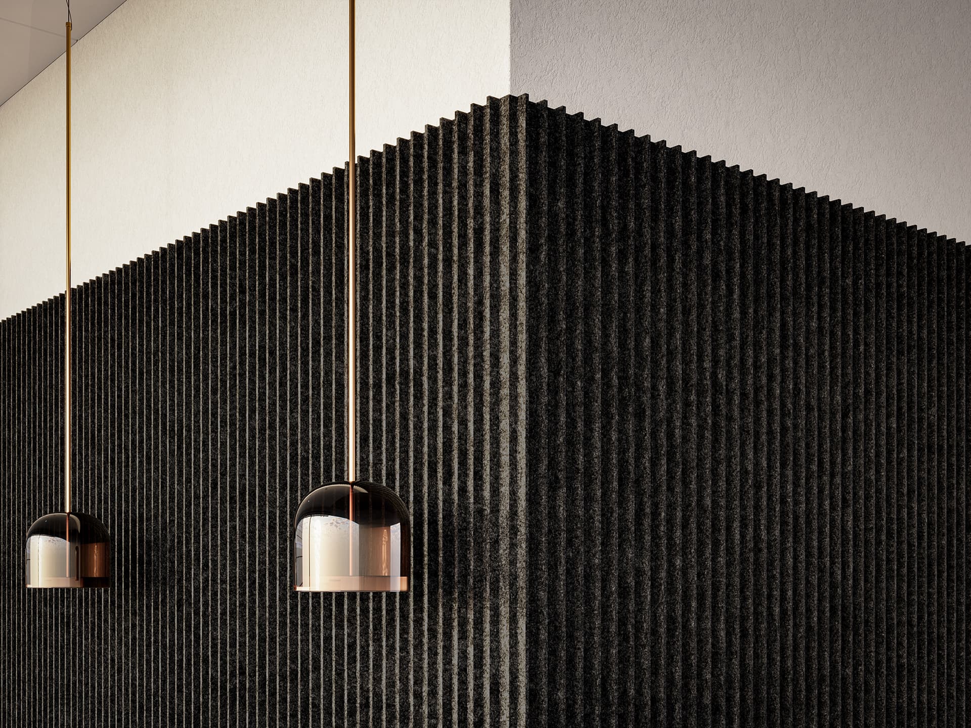 Modern interior with two cylindrical pendant lights hanging from the ceiling. The acoustic felt wall features a black, textured design with vertical grooves, creating a contrast with the smooth white ceiling above.